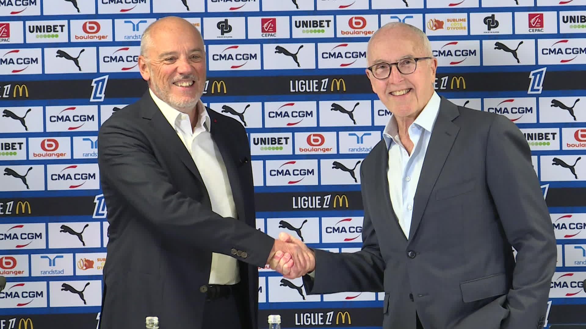 Franck McCourt, propriétaire de l'OM, accueille Stéphane Richard, nouveau président du club phocéen.